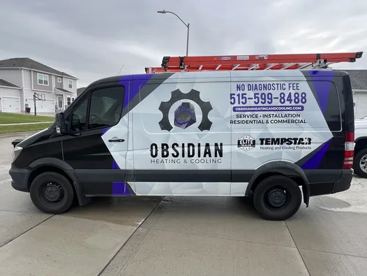Obsidian Heating and Cooling service van at a Des Moines residential driveway